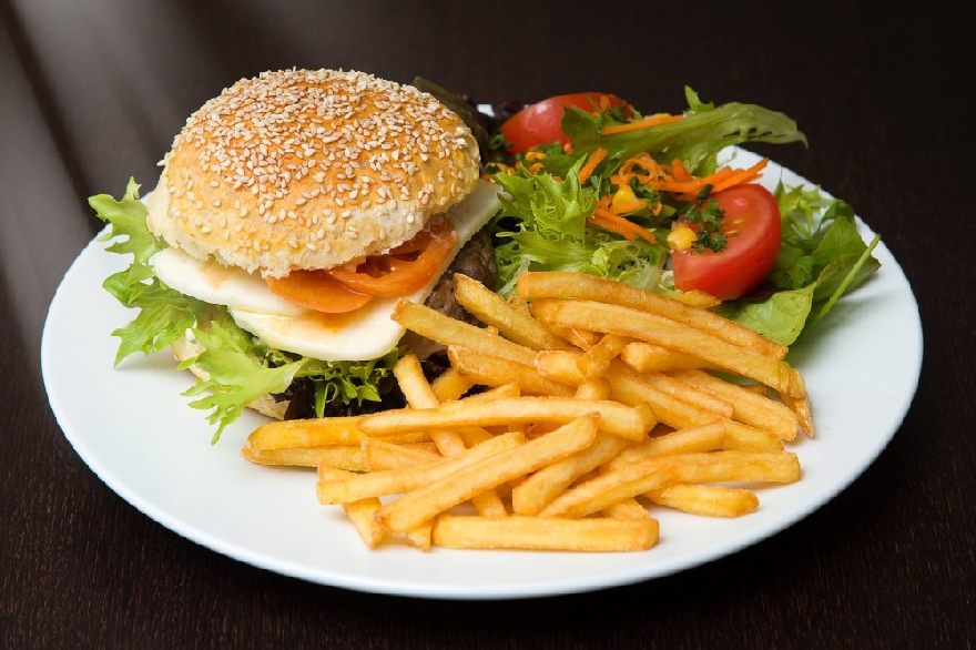 Hamburger menu with fries and salad
